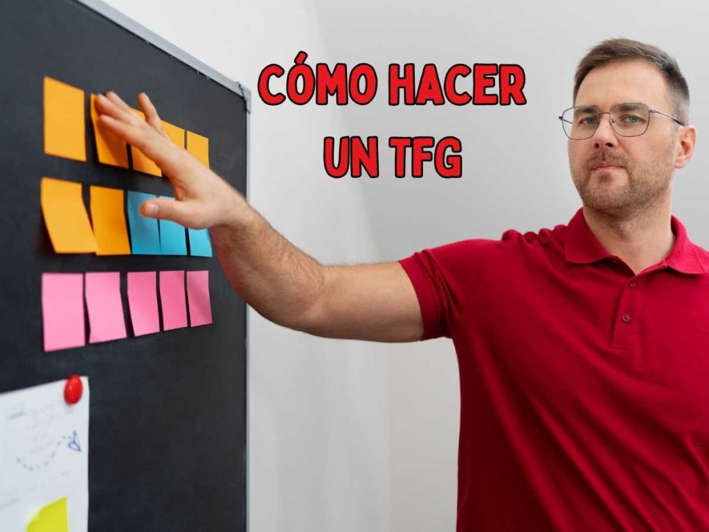 Estudiante trabajando en su TFG y materiales de estudio